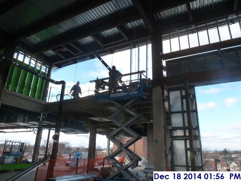 Installing metal framing along the lower roof Facing North